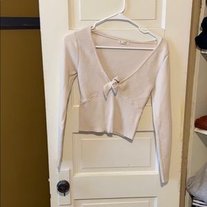 Cream sweater with tie in front